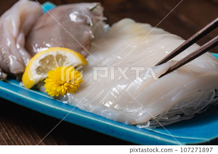 Fresh squid sashimi. Also called squid somen. 107271897