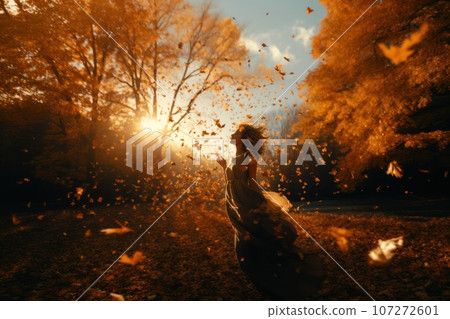 In the heart of a lush forest, a woman stands amidst a swirling vortex of falling leaves. The autumn leaves create a vibrant display, creating a breathtaking scene of nature's beauty. Generative Ai 107272601
