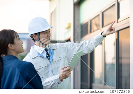 A man wearing work clothes A man wearing work clothes 107272866