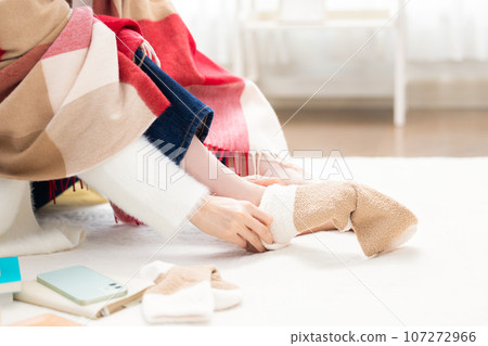 A woman's feet wearing warm socks 107272966