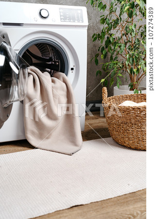 Cropped photos of bathroom interior with washing machine 107274389