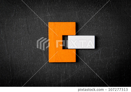 Concept of logic. Colorful wooden blocks on a dark chalkboard background Concept of logic. Colorful wooden blocks on a dark chalkboard background 107277313