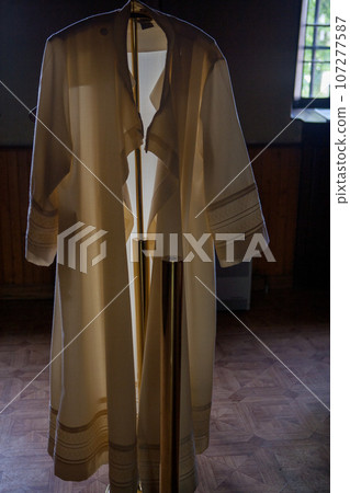 Sacred Stole: Priest's Vestment in Sunlit Sacristy 107277587