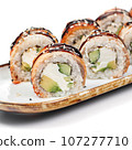 asian food - sushi roll with eel on plate on white background. 107277710