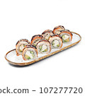 asian food - sushi roll with eel on plate on white background. 107277720