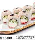 asian food - sushi roll with shrimp, cucumber and masago caviar. 107277737