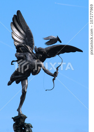 The Greek God Anteros on the top pf the Shaftesbury Memorial Fountain in Piccadilly Circus in London The Greek God Anteros on the top pf the Shaftesbury Memorial Fountain in Piccadilly Circus in London 107277969