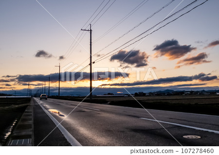 dawn on the rural road 107278460