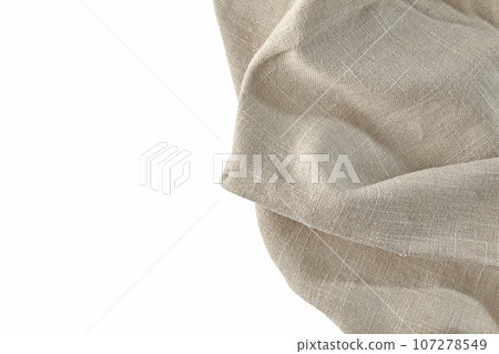 Beige rough linen kitchen towel tablecloth isolated on white background Beige rough linen kitchen towel tablecloth isolated on white background 107278549