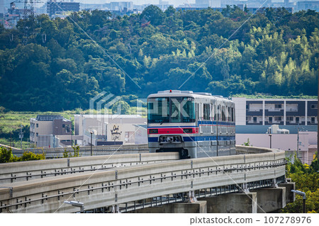 Osaka Monorail Saito Line, train heading towards Banpaku Kinen Koen Station 107278976