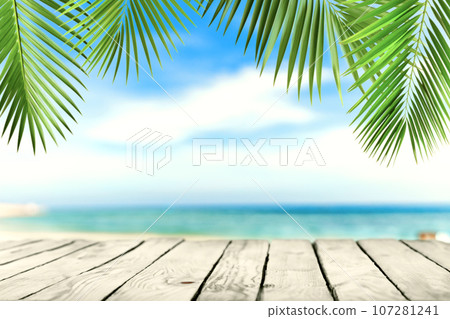 Empty wooden planks with beach, palms. Background for product, content placement 107281241