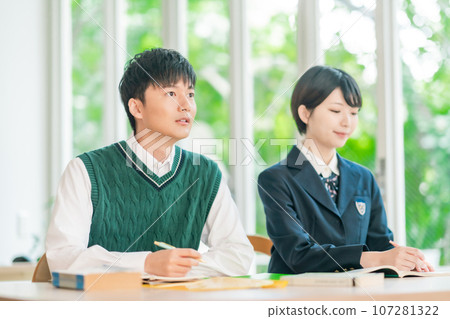 High school students taking classes in a bright classroom High school students taking classes in a bright classroom 107281322