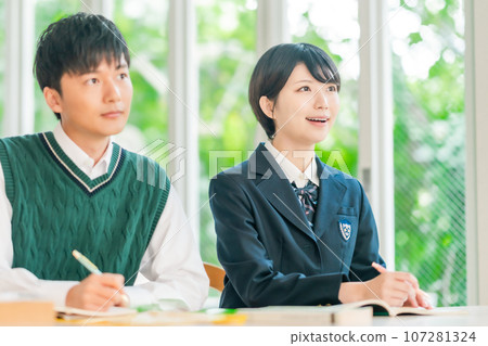 High school students taking classes in a bright classroom High school students taking classes in a bright classroom 107281324