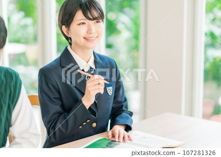 High school students taking classes in a bright classroom High school students taking classes in a bright classroom 107281326