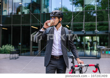 Elegant businessman in hemlet with electric scooter 107281409