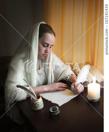Woman write letter on vintage paper for writing on wooden table Woman write letter on vintage paper for writing on wooden table 107281439