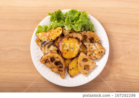 Stir-fried sweet potato and lotus root Stir-fried sweet potato and lotus root 107282286