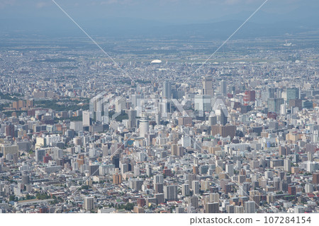 Sapporo's built-up area and JR Tower seen from the observation deck at the summit of Mt. Moiwa 107284154
