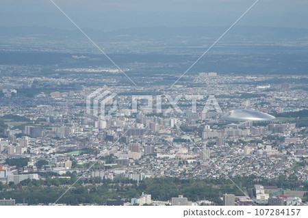 Sapporo's built-up area and Sapporo Dome seen from the observation deck at the summit of Mt. Moiwa 107284157