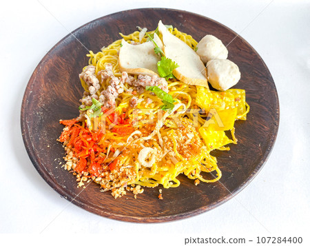 Yellow dried noodles Thai food style on white background Yellow dried noodles Thai food style on white background 107284400