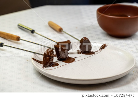 Process of making handmade sweets in outdoor workshop 107284475