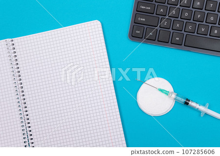 Vaccination or Revaccination Concept - Three Insulin Syringe on Blue Table Vaccination or Revaccination Concept - Three Insulin Syringe on Blue Table 107285606