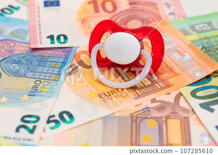 Baby Pacifier on the Euro Banknotes 107285610