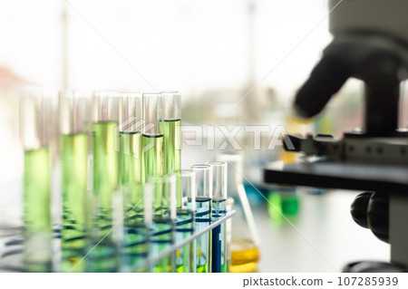 Science equipment in the laboratory. Beaker, test tube, microscope. Children STEM education theme. Science equipment in the laboratory. Beaker, test tube, microscope. Children STEM education theme. 107285939