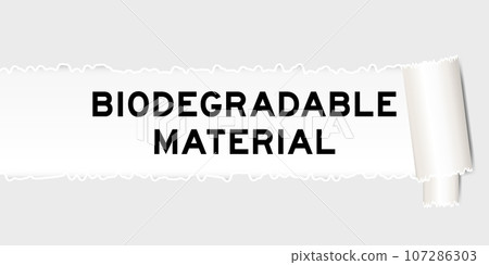 Ripped gray paper background that have word biodegradable material under torn part 107286303