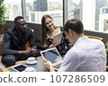 Happiness business team Colleagues talking talking and discuss in cafe during break in restaurant. 107286509