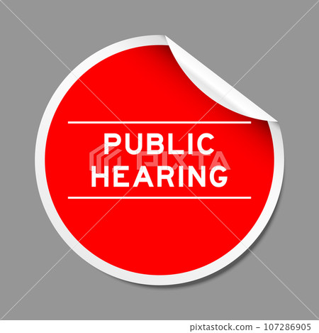 Red color peel sticker label with word public hearing on gray background Red color peel sticker label with word public hearing on gray background 107286905