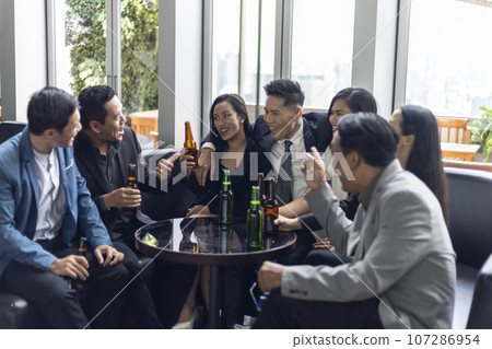 Happiness young bubiness teamwork party activity after work in restaurant. Happiness young bubiness teamwork party activity after work in restaurant. 107286954