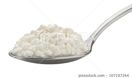 Spoon of homemade low fat yogurt isolated on white background, probiotic fermented sour milk 107287264