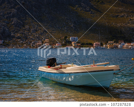 View on Symi or Simi island harbor port, classical ship yachts, houses on island hills, Aegean Sea bay. Greece islands holidays vacation travel tours from Rhodos island. Symi, Greece, Dodecanese. View on Symi or Simi island harbor port, classical ship yachts, houses on island hills, Aegean Sea bay. Greece islands holidays vacation travel tours from Rhodos island. Symi, Greece, Dodecanese. 107287828