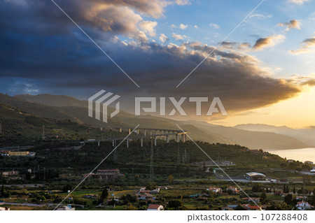 Dusk over Santo Stefano di Camastra to the island of Sicily 107288408