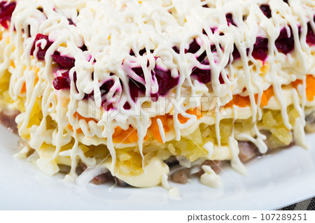 Russian dressed herring salad 107289251