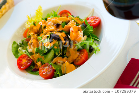 Tasty salad with Seafood Cocktail 107289379