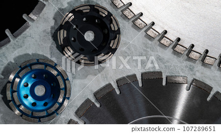 Diamond disks and bowls of different sizes and shapes lie on the table. Diamond disks and bowls of different sizes and shapes lie on the table. 107289651