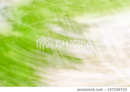 Blurred motion bokeh holiday glitter background 107289720