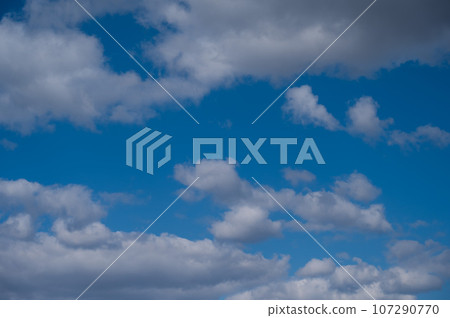 Cumulus clouds against the blue sky on a summer day. Cumulus clouds against the blue sky on a summer day. 107290770