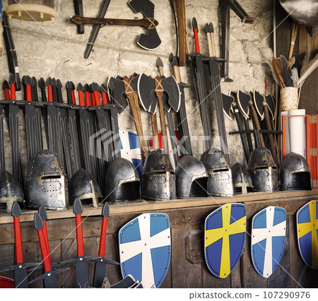 Rack with helmets, shields and swords 107290976