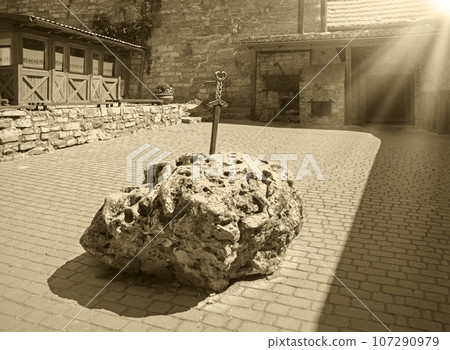 Iron sword in the stone on the square 107290979