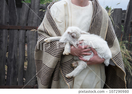 Shepherd with a sheep in his arms Shepherd with a sheep in his arms 107290980