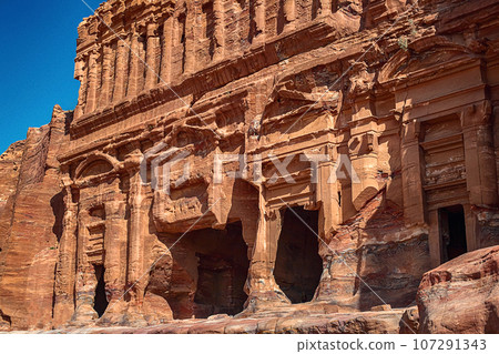 View of the temple and building carved into the sandstone rock. Petra, Jordan. 107291343