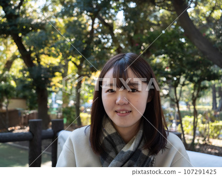 A Beautiful young Japanese woman looking happy A Beautiful young Japanese woman looking happy 107291425
