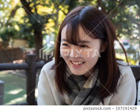A Beautiful young Japanese woman laughing 107291429