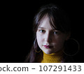 A beautiful young woman posing for portraits 107291433