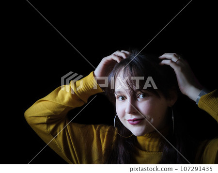 A beautiful young woman posing for portraits 107291435