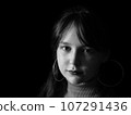 A beautiful young woman posing for portraits 107291436