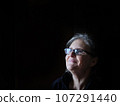 A beautiful middle aged lady posing for the camera 107291440